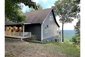 Rocking chairs and porch swing on front porch for your enjoyment