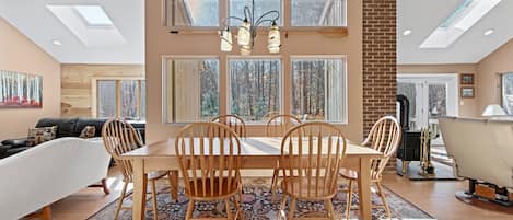 Dining Room with cherry table, seating for 8 people.  View of back yard & deck.