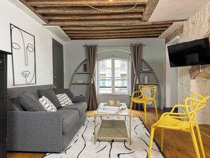 A roomy living room with double sofa.