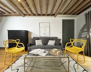 The living area includes a sofa, HD TV, and high-speed Wi-Fi for your use.