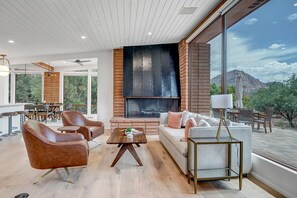 Additional Seating Area with Sleeper Sofa and Large Gas Fireplace