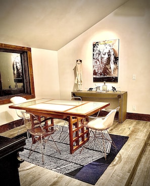 Dining Table and Custom Artwork in Second Story Dining Area with Kitchenette.