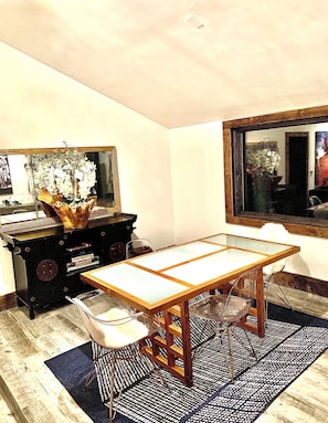 Dining Table and Custom Artwork in Second Story Dining Area with Kitchenette.