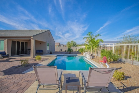 Large private backyard with built-in pool, outside seating, gas firepit, BBQ