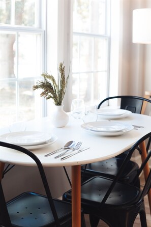 Multi-use table & chairs that can function as an dinning space or desk for remote work