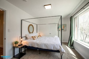 As you sink into the plush mattress and feel the softness of the high-quality linens, you'll be transported to a realm of tranquility. The king-sized bed provides ample space to stretch out and find your perfect sleeping position.