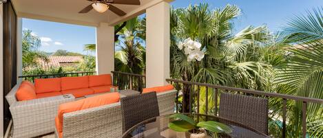 Private balcony overlooking pools. Spacious outdoor entertaining & dining area.