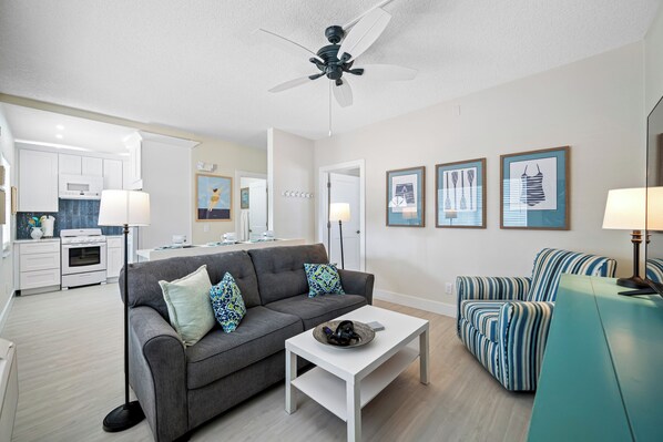 A spacious and beautifully decorated living area with comfortable seating, perfect for relaxation.