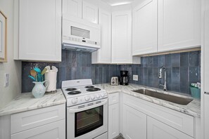 Sleek design with high-end appliances, ample counter space, and everything you need for home-cooked meals