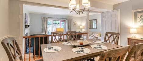 Gather around the large dining room overlooking the living room.