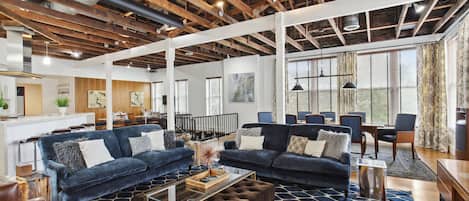 Lush, open loft! - Midnight blues, velvets & leather play against the exposed beams and pine floors!