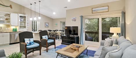 1692 Bluff Villas - Living Area - Perfect place to relax after a day at the beach or exploring the island.  Beautiful open floor plan with high ceilings and sliding doors to private balcony.  
Plenty of seating for up to 8 people.