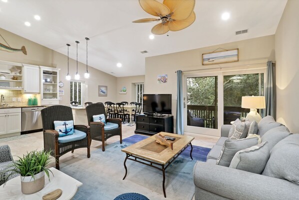 1692 Bluff Villas - Living Area - Perfect place to relax after a day at the beach or exploring the island.  Beautiful open floor plan with high ceilings and sliding doors to private balcony.  
Plenty of seating for up to 8 people.