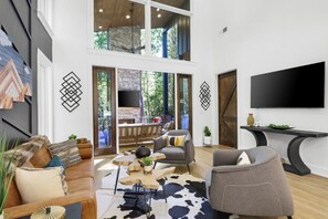 Bright and airy the living room opens up to the outdoor patio.