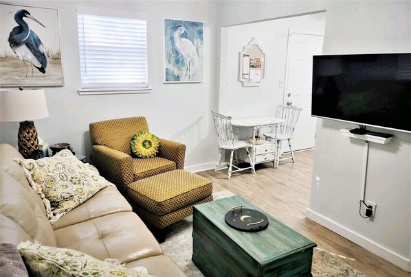 Living room W 42" smart TV with apps to access your subscriptions.