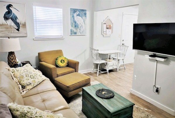 Living room W 42" smart TV with apps to access your subscriptions.
