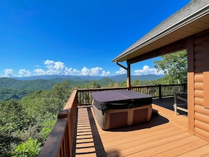 Hot tub - Hot tub on open deck overlooking mountain view