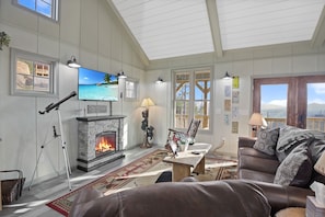 Main living area with TV with Roku and electric fireplace