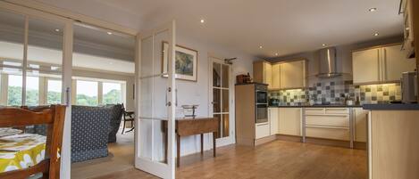 First floor: Kitchen dining area leading to the sitting room