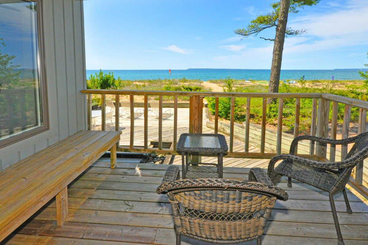 Lower-level beachfront condo with deck, fireplace, washer/dryer, central AC