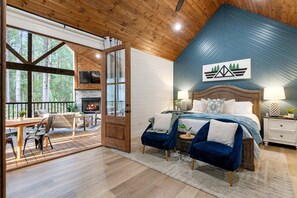 The spacious primary retreat with french doors leading to the patio