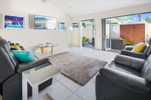 Cool spacious living room opening up to your own private court yard.