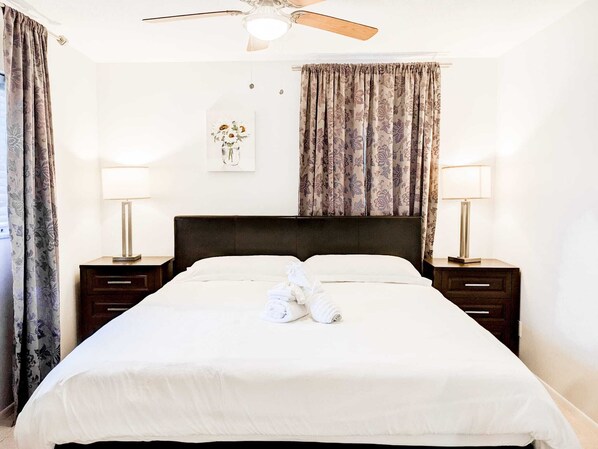 Bedroom #2: King size bed with ceiling fan.