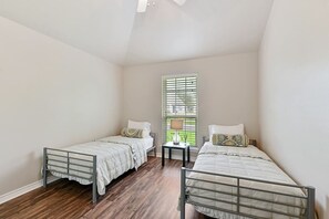 Step into the first bedroom equipped with two twin beds