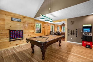 Play and entertain in Game room, with pool table, arcade game and wall games