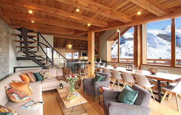 Relax in the bright living area with a large sectional sofa.
