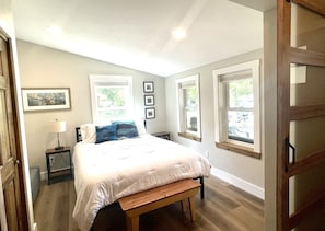 Downstairs queen size bedroom with sliding barn doors