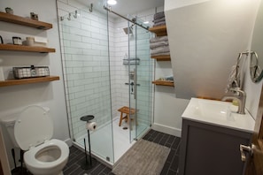 Enjoy a shower in this bright and newly finished bathroom. 
