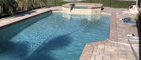  Salt water heated pool with spa, lounge chairs, adjacent to lanai w grill. 