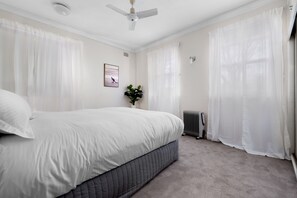 Bright and airy downstairs queen bedroom with ensuite.