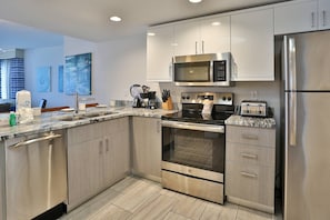 Fully Equipped Kitchen with all Stainless Appliances and Granite Counters