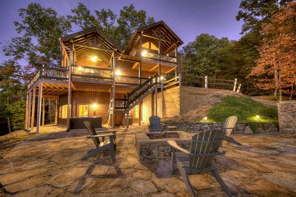 Cozy outdoor firepit area with scenic mountain views.