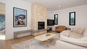 Open plan TV area with fireplace 