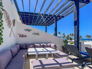 Outdoor dining and view to the amazing Caribbean sea and palms