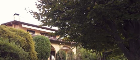 The villa with its arches leading to the living room, master bedroom's terrace