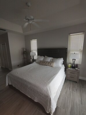 spacious master with view of pool
