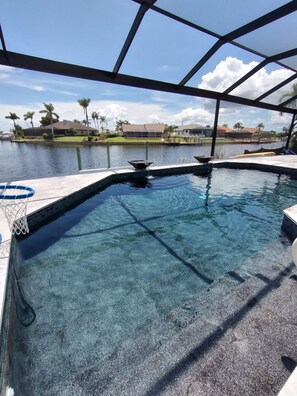"picture window" pool screens, all new travertine since hurricane Ian 2022
