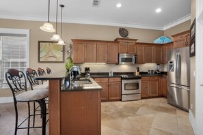 The spacious kitchen is well appointed and ready for you to cook a favorite meal