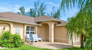 Front patio with welcoming seating to enjoy the quiet neighborhood