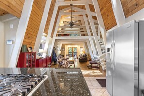 Looking from the kitchen to the loft above and dining room and living room below