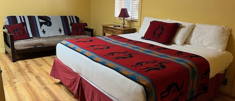 King sized bed is complimented by a full-sized futon that sleeps an additional 2 people for a total capacity of 4 guests.