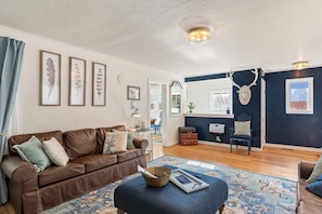 The living room and entryway create an open space that’s welcoming and charming.