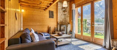 Stylish living area with wood and slate floor