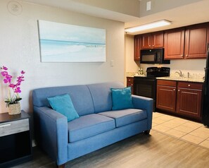 Indulge yourself in the living room with this comfortable sofa and a spectacular view outside.