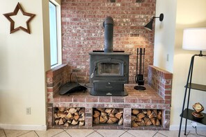 Warm up on a chilly evening by building a fire in the wood stove.