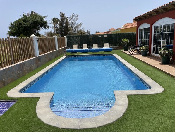 Spacious heated pool and large patio area.